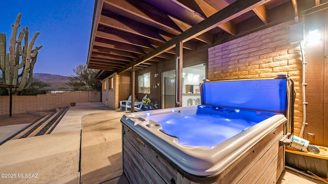 900 N Camino Del Codorniz, Tucson, AZ 85749 - view of patio with a hot tub and a mountain view