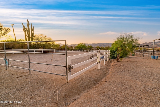 900 N Camino Del Codorniz, Tucson, AZ 85749 - view of yard with a mountain view, an enclosed horse arena, and a view of rural / pastoral area