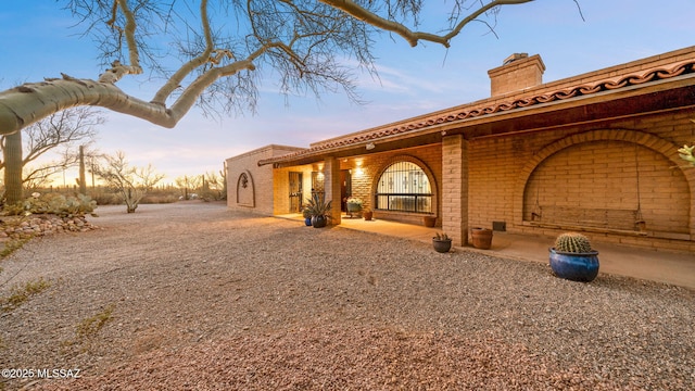 900 N Camino Del Codorniz, Tucson, AZ 85749 - view of side of property with a chimney