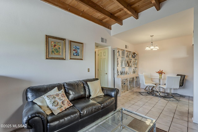 living area featuring an inviting chandelier, visible vents, light tile patterned flooring, wooden ceiling, and lofted ceiling with beams