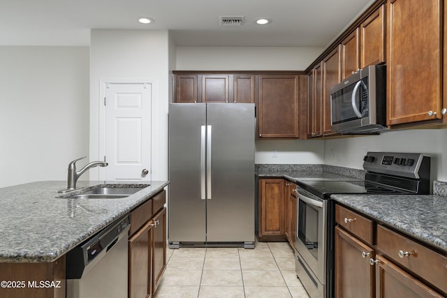 kitchen with visible vents, recessed lighting, a sink, light tile patterned floors, and stainless steel appliances