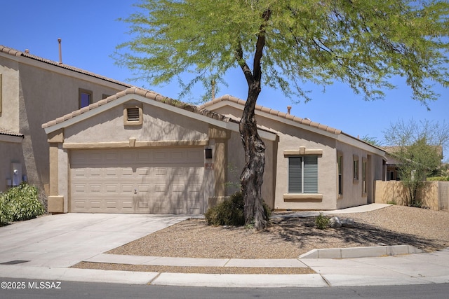493 E Placita Nodo, Sahuarita, AZ 85629 - ranch-style home featuring a garage, stucco siding, driveway, and a tiled roof