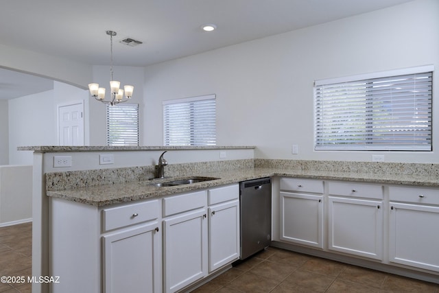 493 E Placita Nodo, Sahuarita, AZ 85629 - kitchen featuring stainless steel dishwasher, visible vents, dark tile patterned floors, a chandelier, and a sink