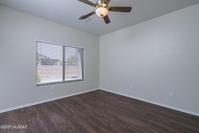 493 E Placita Nodo, Sahuarita, AZ 85629 - unfurnished room with a ceiling fan, baseboards, visible vents, and dark wood finished floors