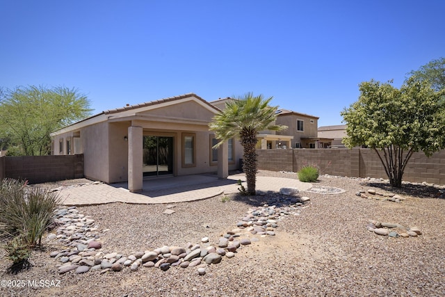 493 E Placita Nodo, Sahuarita, AZ 85629 - back of house with a patio, a fenced backyard, stucco siding, and a tiled roof