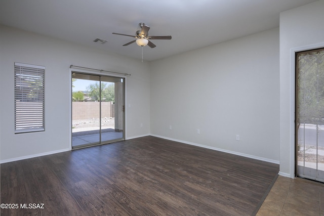493 E Placita Nodo, Sahuarita, AZ 85629 - empty room with visible vents, baseboards, ceiling fan, and dark wood-style floors