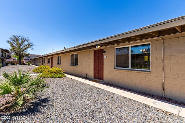 view of front of home with concrete block siding