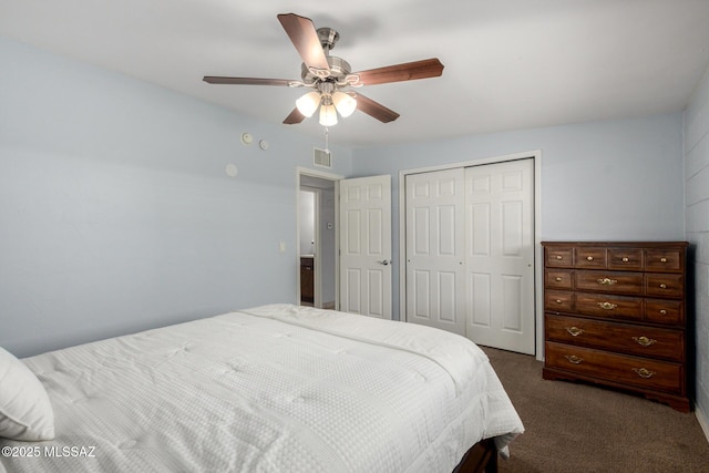 bedroom with ceiling fan, a closet, dark carpet, and visible vents