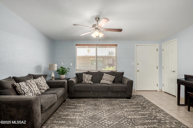 tiled living area with a ceiling fan