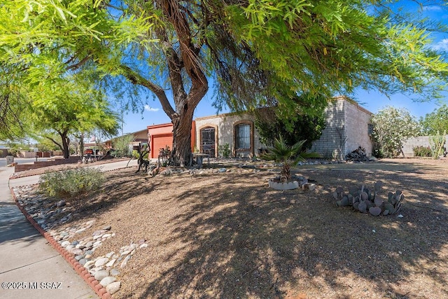 7420 N Oliver Ave, Tucson, AZ 85741 - view of front of property with an attached garage, fence, and brick siding