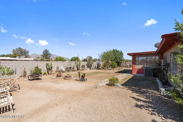 7420 N Oliver Ave, Tucson, AZ 85741 - view of yard with a mountain view, a fenced backyard, and a sunroom