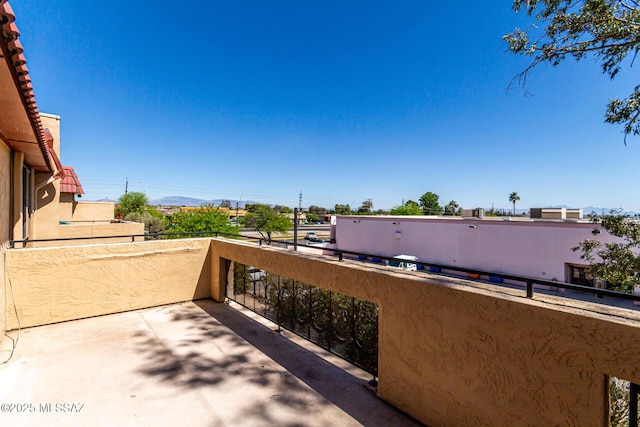 view of patio featuring a balcony