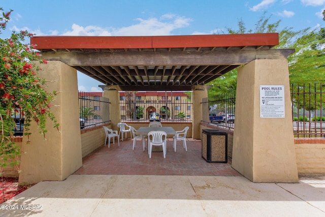 view of patio / terrace featuring fence