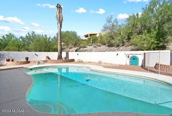 4361 N Wilmot Rd, Tucson, AZ 85750 - view of swimming pool with a fenced in pool and fence