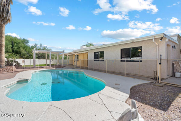 4361 N Wilmot Rd, Tucson, AZ 85750 - view of pool featuring fence, a fenced in pool, a pergola, and a patio