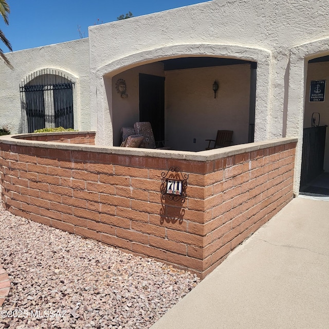 property entrance featuring stucco siding