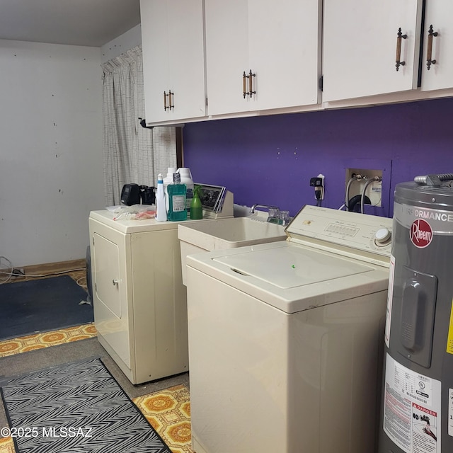 clothes washing area featuring water heater, cabinet space, and independent washer and dryer