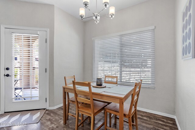 1500 E Pusch Wilderness Dr Unit 10105, Oro Valley, AZ 85737 - dining room with a chandelier, wood finished floors, and baseboards