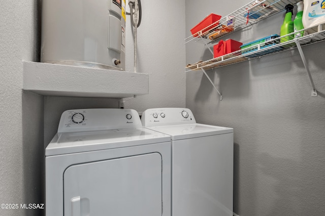 1500 E Pusch Wilderness Dr Unit 10105, Oro Valley, AZ 85737 - laundry room with independent washer and dryer and a textured wall