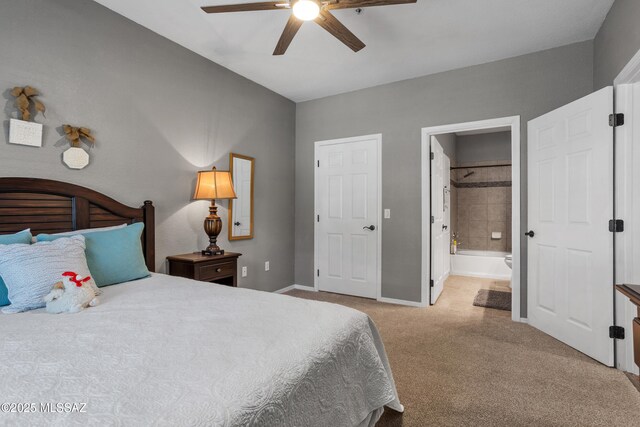 1500 E Pusch Wilderness Dr Unit 10105, Oro Valley, AZ 85737 - bedroom featuring carpet flooring, baseboards, ensuite bathroom, and ceiling fan