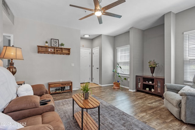 1500 E Pusch Wilderness Dr Unit 10105, Oro Valley, AZ 85737 - living area featuring ceiling fan, wood finished floors, and baseboards