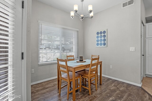 1500 E Pusch Wilderness Dr Unit 10105, Oro Valley, AZ 85737 - dining area featuring a chandelier, wood finished floors, and baseboards