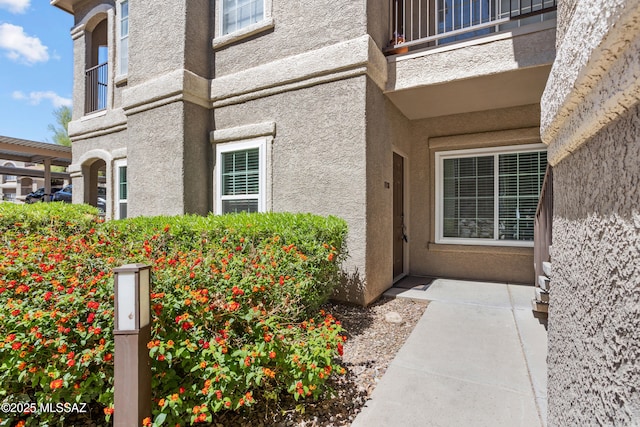 1500 E Pusch Wilderness Dr Unit 10105, Oro Valley, AZ 85737 - doorway to property featuring stucco siding and a balcony