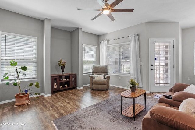 1500 E Pusch Wilderness Dr Unit 10105, Oro Valley, AZ 85737 - living room featuring a ceiling fan, wood finished floors, and healthy amount of natural light