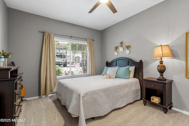 1500 E Pusch Wilderness Dr Unit 10105, Oro Valley, AZ 85737 - bedroom with light carpet, baseboards, and ceiling fan