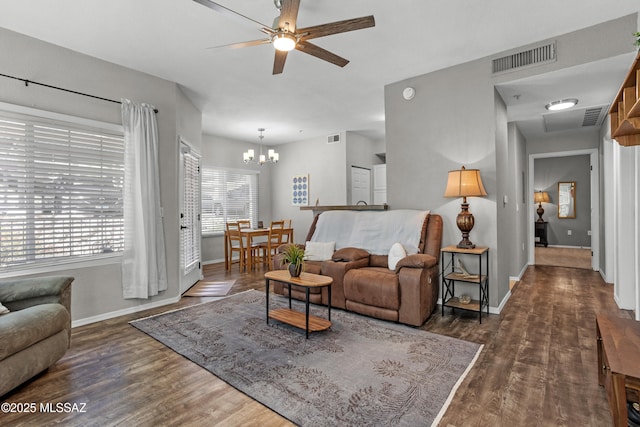 1500 E Pusch Wilderness Dr Unit 10105, Oro Valley, AZ 85737 - living room with baseboards, ceiling fan, wood finished floors, and a chandelier