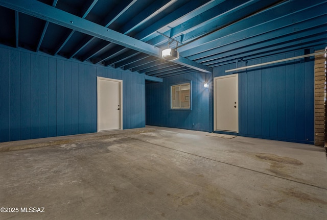 7555 E 25th St, Tucson, AZ 85710 - interior space with wooden walls and a garage door opener
