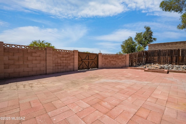 7555 E 25th St, Tucson, AZ 85710 - interior space with a garage door opener and wooden walls