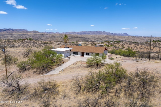 view of mountain feature featuring view of desert and a rural view