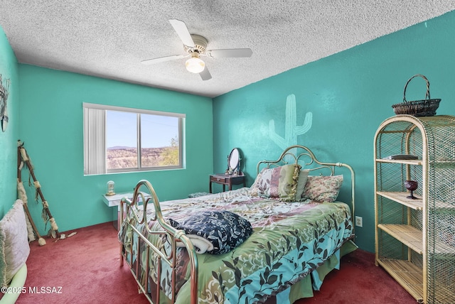 bedroom featuring a ceiling fan, a textured ceiling, and carpet