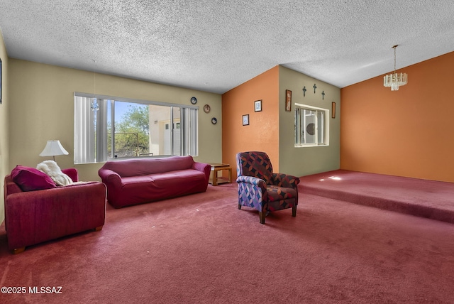 living room featuring carpet flooring, a textured ceiling, and a chandelier