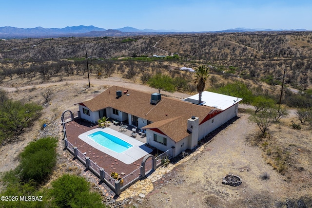 aerial view featuring a mountain view and view of desert
