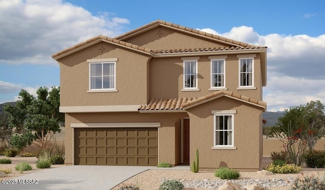 view of front of house with stucco siding, concrete driveway, a tile roof, and a garage