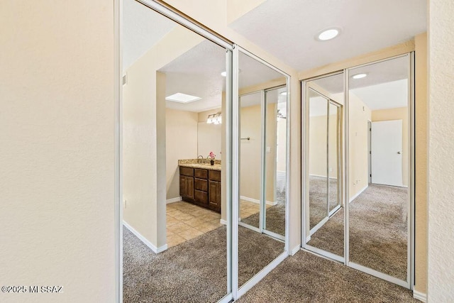 bathroom with baseboards and vanity