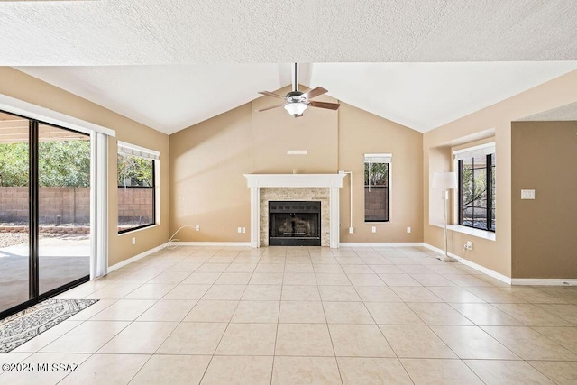 unfurnished living room with light tile patterned floors, ceiling fan, and plenty of natural light