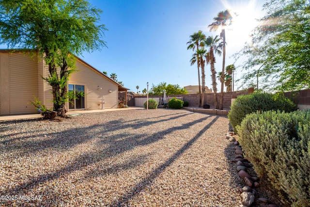 view of yard with a fenced backyard and a patio area
