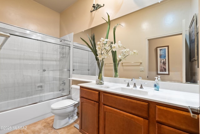 full bathroom with vanity, enclosed tub / shower combo, tile patterned floors, and toilet