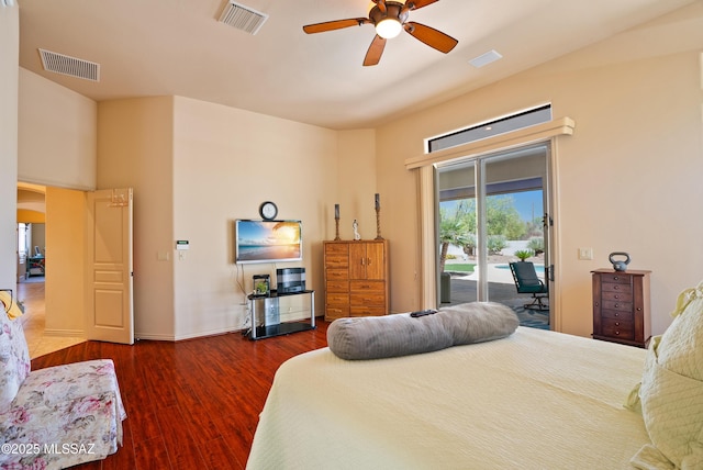 bedroom with visible vents, baseboards, wood finished floors, and access to outside