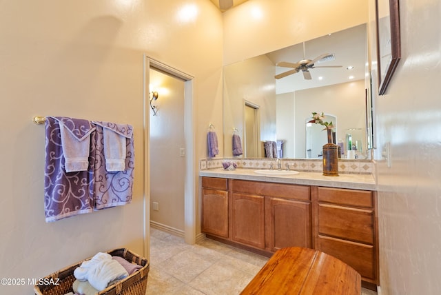 bathroom with a ceiling fan, tile patterned flooring, and vanity