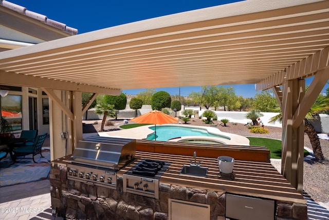 view of patio / terrace with a pergola, a fenced backyard, area for grilling, an outdoor kitchen, and an in ground hot tub