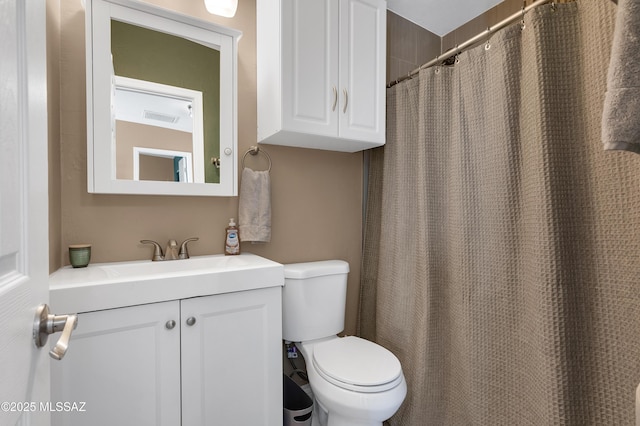 215 E Lester St, Tucson, AZ 85705 - bathroom with visible vents, a shower with curtain, toilet, and vanity