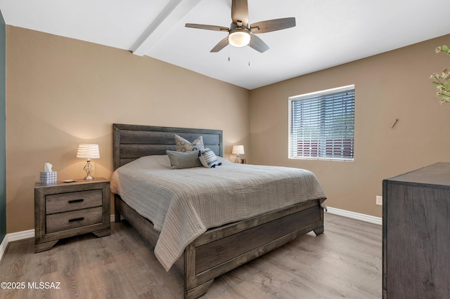 215 E Lester St, Tucson, AZ 85705 - bedroom with baseboards, lofted ceiling with beams, ceiling fan, and wood finished floors