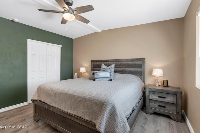 215 E Lester St, Tucson, AZ 85705 - bedroom featuring baseboards, ceiling fan, a closet, and wood finished floors