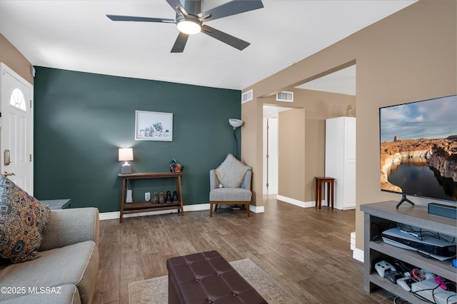 215 E Lester St, Tucson, AZ 85705 - living room featuring a ceiling fan, wood finished floors, and visible vents