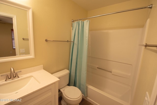 full bath with vanity, shower / tub combo with curtain, and toilet