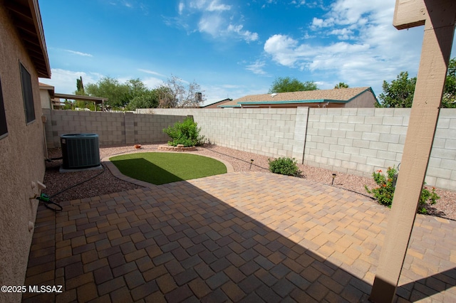 view of patio / terrace featuring central AC unit and a fenced backyard